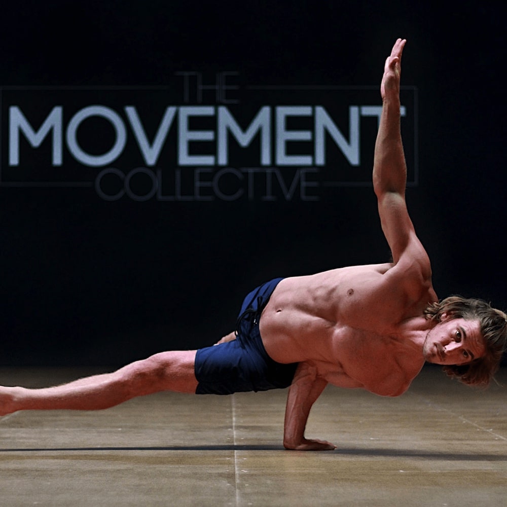 rod cooper man doing gymnastics handstand on a single arm